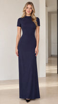 Front view of model wearing Navy Blue mock neck short sleeve maxi column dress