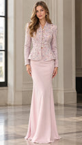 Front view of woman wearing blush pink embellished tweed peplum jacket and matching floor-length mermaid skirt