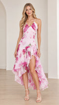 Front view of model wearing Blush Pink floral print ruffle high-low maxi dress