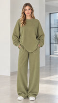Front full view of woman wearing olive green ribbed oversized sweatshirt and wide-leg lounge pants set