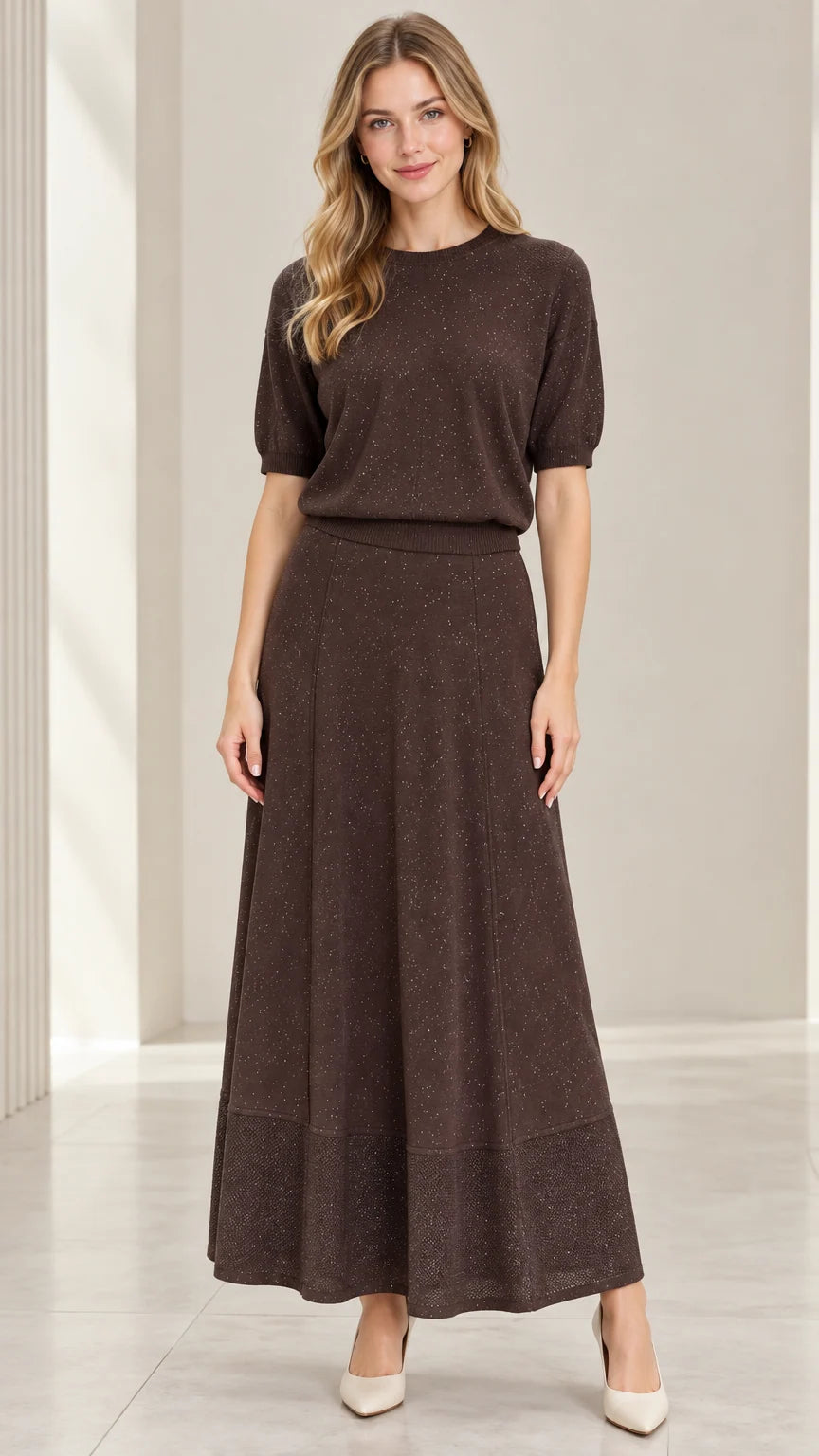 Front full-length view of model wearing coffee brown shimmer knit top and matching maxi skirt set