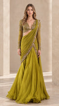 Front view of olive green pre-draped saree gown with long sleeve beaded bodice