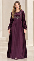 Front full-length view of woman wearing Plum embroidered velvet pleated maxi dress