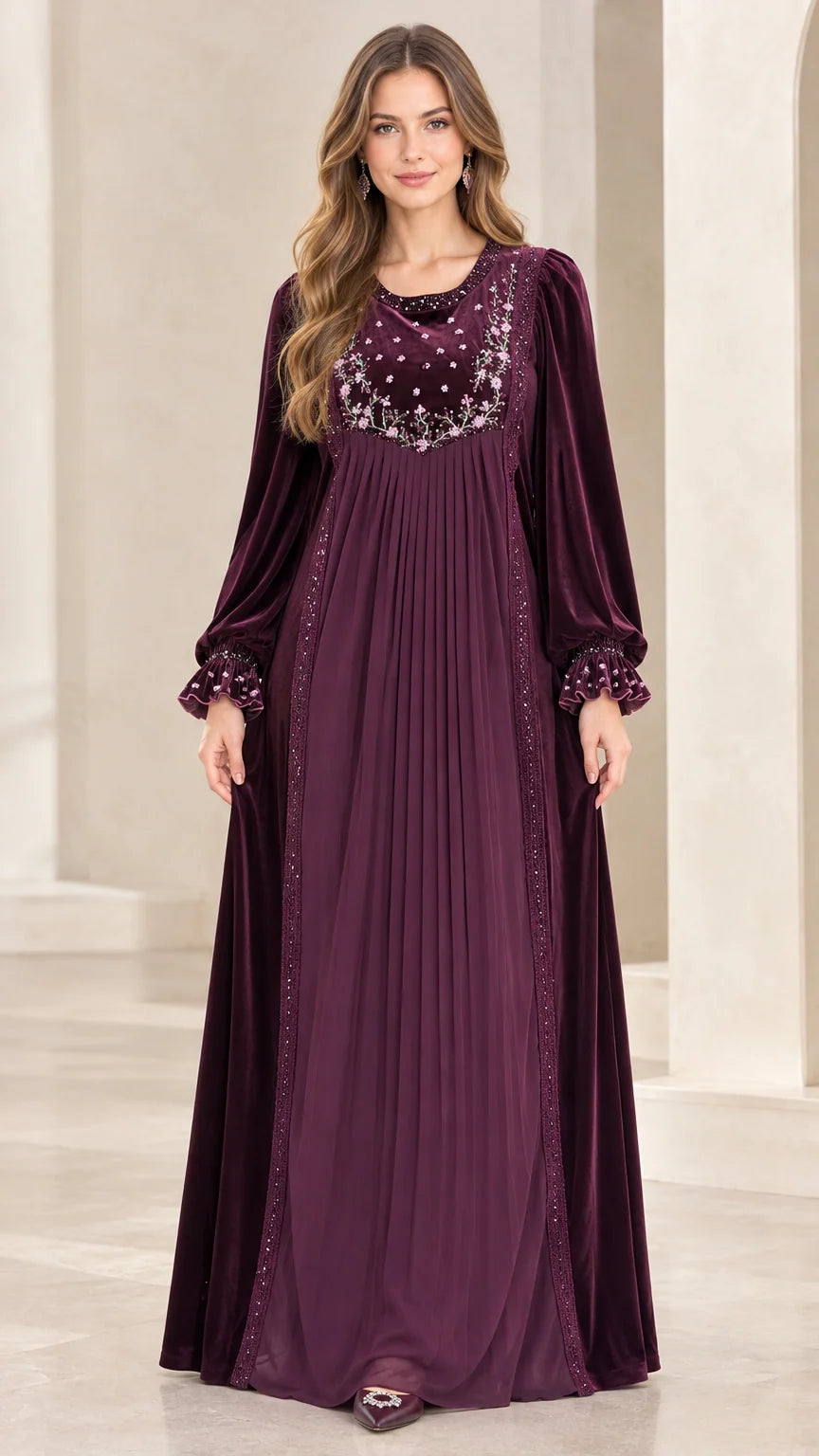 Front full-length view of woman wearing Plum embroidered velvet pleated maxi dress