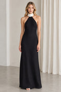 Front view of black halter neck maxi evening gown with white collar
