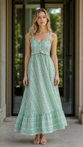 Front view of green floral striped ruffle maxi dress