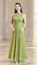 Front view of model wearing light green sleeveless textured plissé A-line maxi dress
