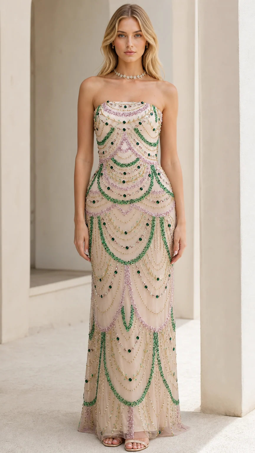 Front view of model wearing the champagne beaded strapless evening gown