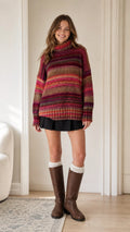 Model wearing Burgundy Multi striped chunky turtleneck sweater front view