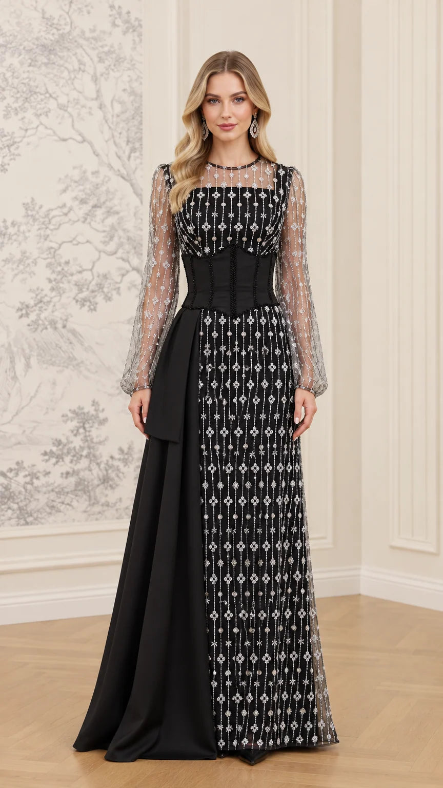Front full view of black rhinestone embellished long sleeve evening gown with corset waist and side drape