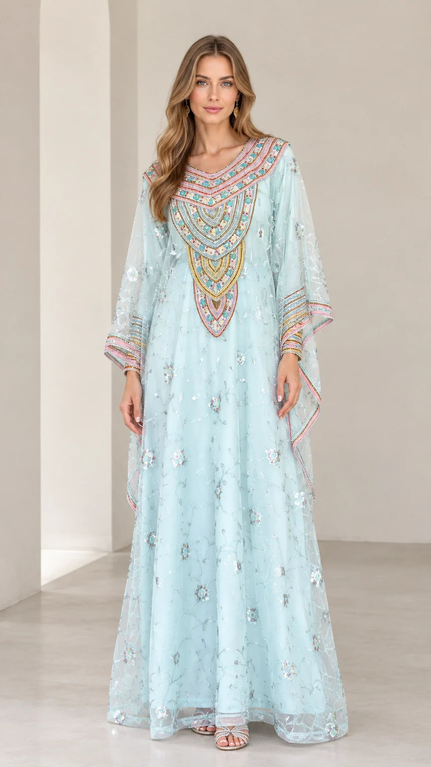 Front full-length view of woman wearing Light Blue embroidered kaftan maxi dress