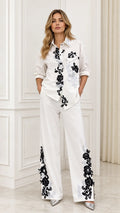 Full front view of white embroidered shirt and pant set