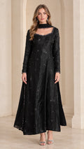 Front view of woman wearing black embellished long sleeve maxi Anarkali gown with matching scarf