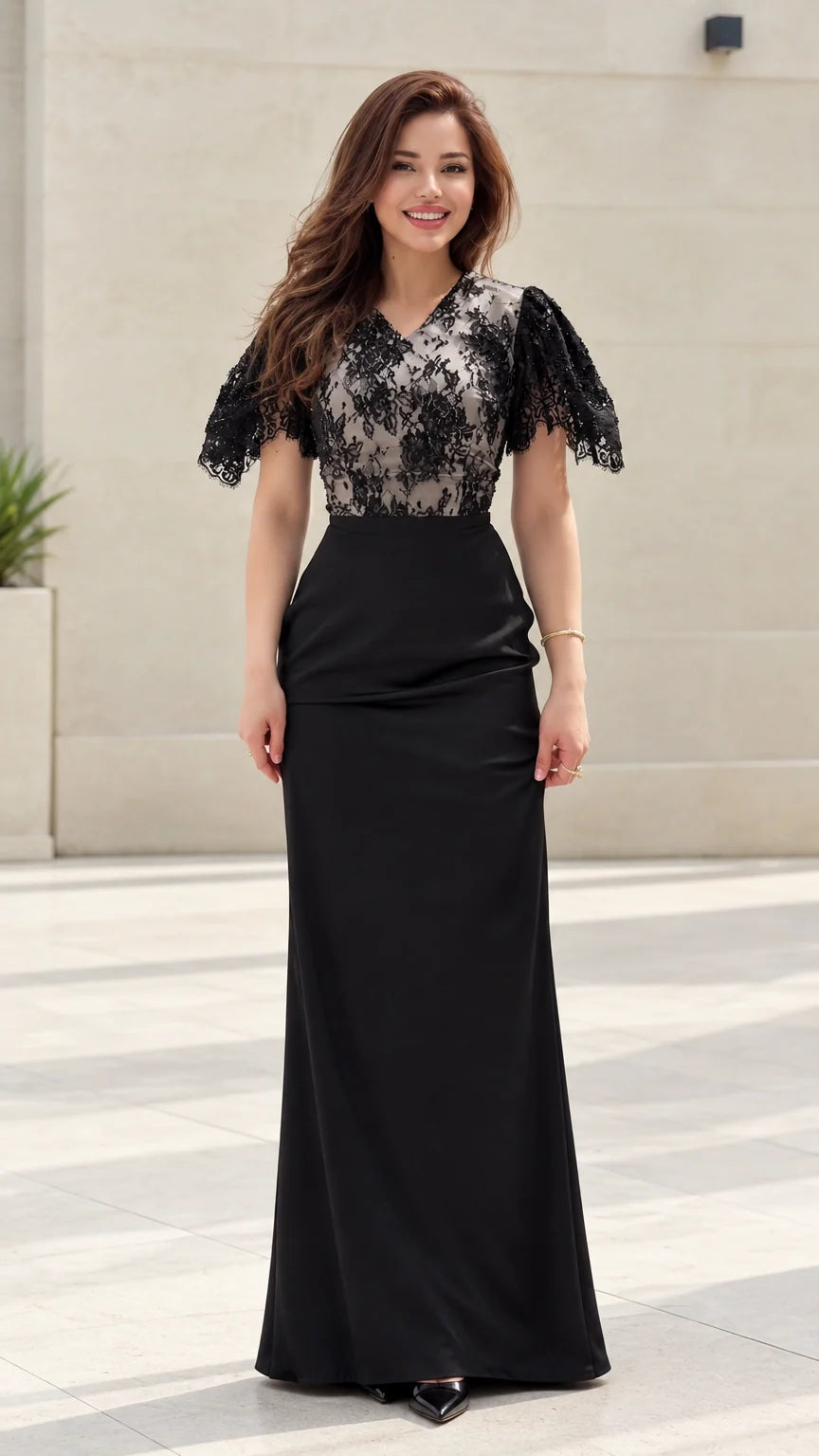 Front view of model wearing black floral lace flutter sleeve maxi evening gown