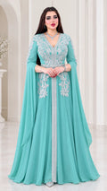 Front view of woman wearing aqua embroidered cape sleeve kaftan maxi dress