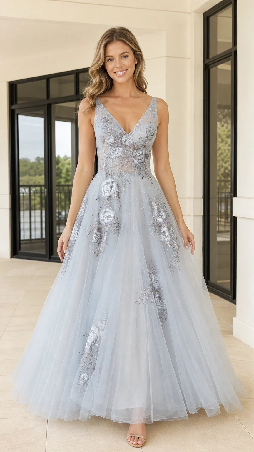 Front view of light blue V-neck tulle evening gown with floral embroidery