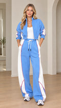 Model wearing sky blue cropped track jacket and matching wide-leg sweatpants set front view