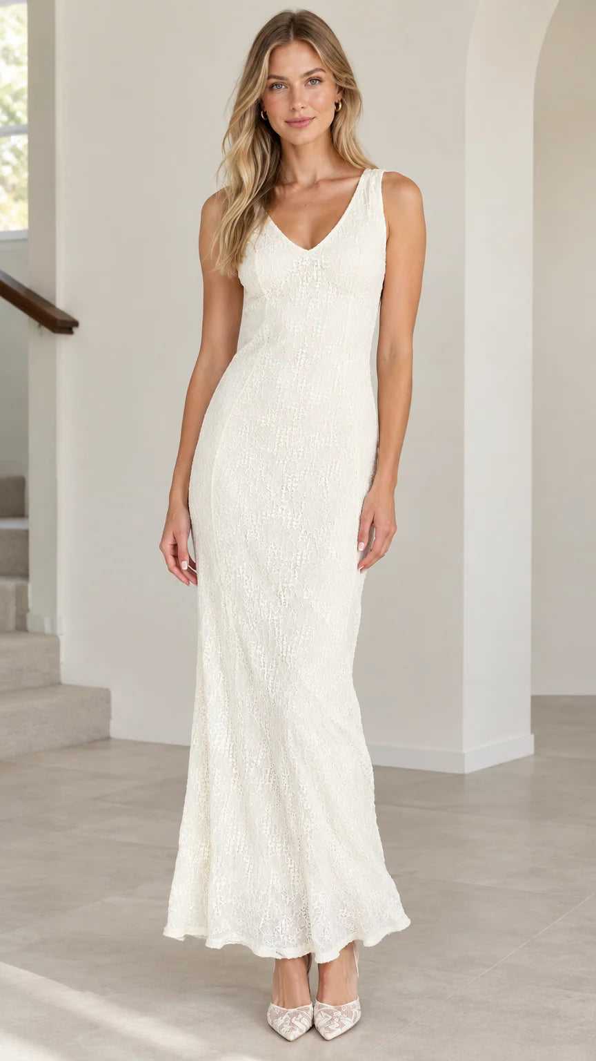 Front view of model wearing ivory sleeveless lace maxi dress with V-neckline