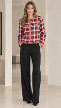 Front view of model wearing red and black plaid cropped tweed jacket with wide leg black pants