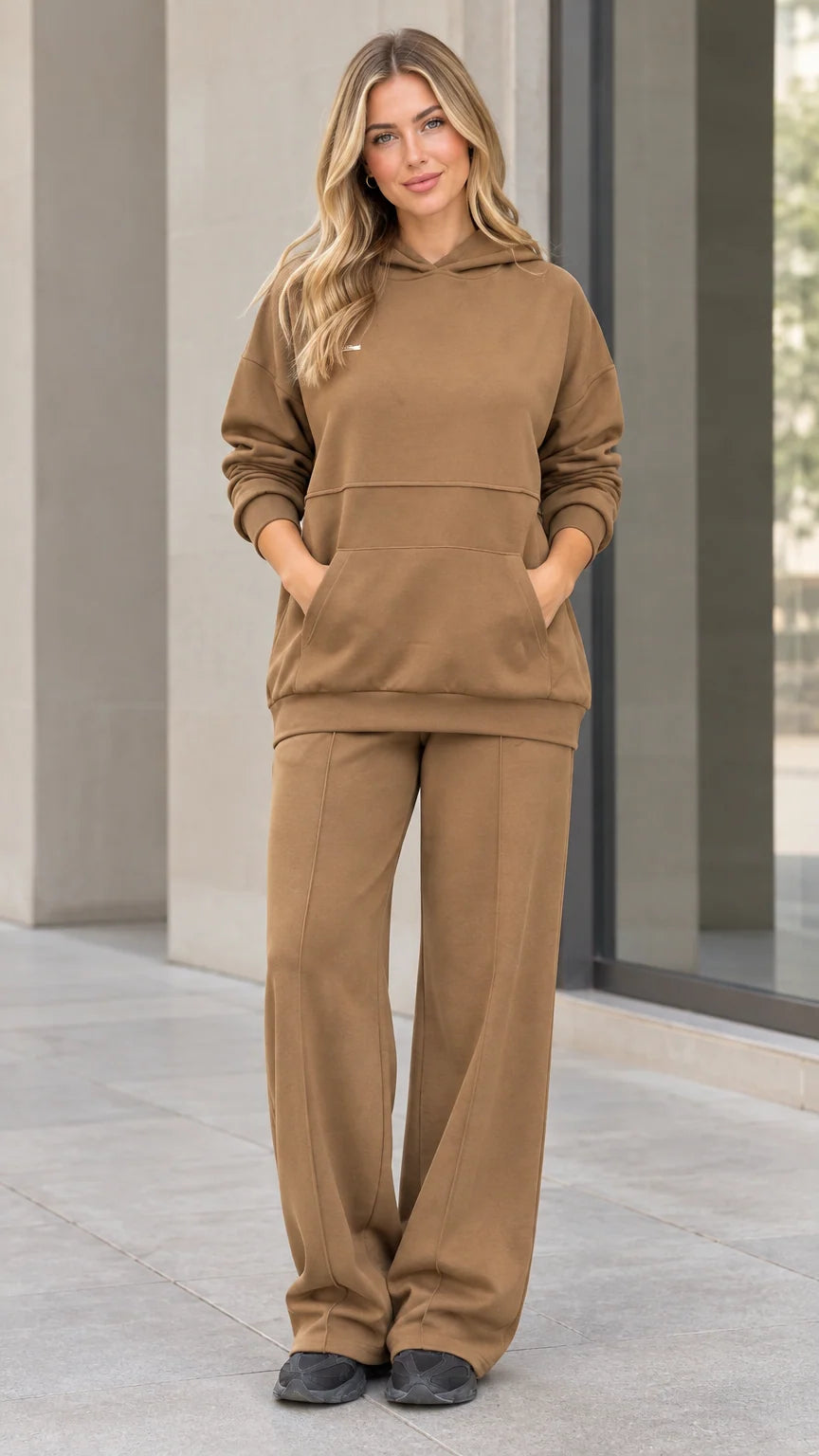 Front view of woman wearing camel fleece hoodie and wide-leg sweatpants matching lounge set