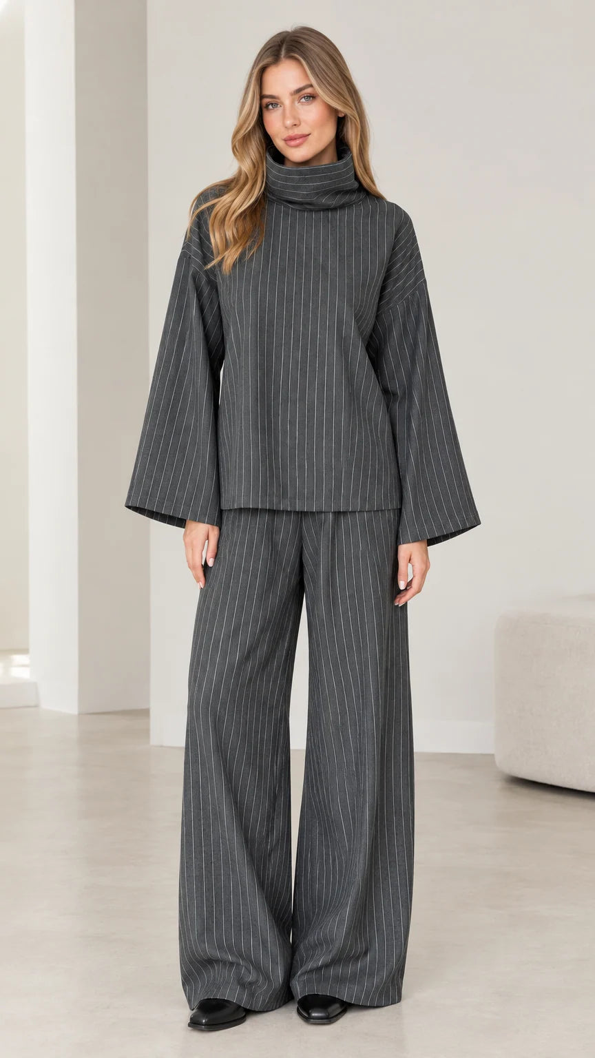 Front view of woman wearing Charcoal Grey pinstripe turtleneck top and wide-leg pants set