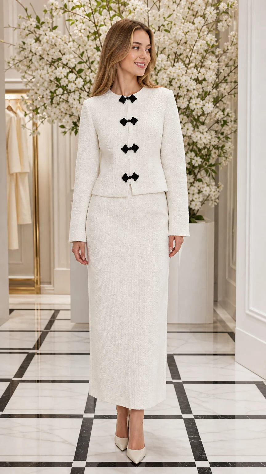 Front full view of woman wearing Ivory White textured collarless jacket and maxi skirt set