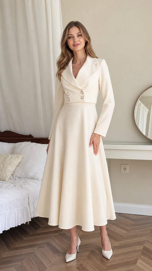 Front full-length view of model wearing cream double-breasted blazer midi dress