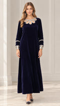 Front view of model wearing Navy Blue long sleeve velvet maxi dress with crystal cutout neckline