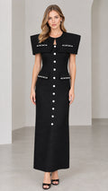 Full front view of elegant black capelet tweed maxi dress with pearl buttons
