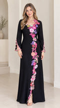 Front view of black long sleeve maxi dress with colorful floral appliqué