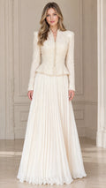 Front full view of woman wearing ivory cream embellished peplum jacket and pleated maxi skirt formal set