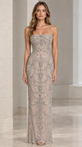 Front view of champagne beaded spaghetti strap column maxi evening gown