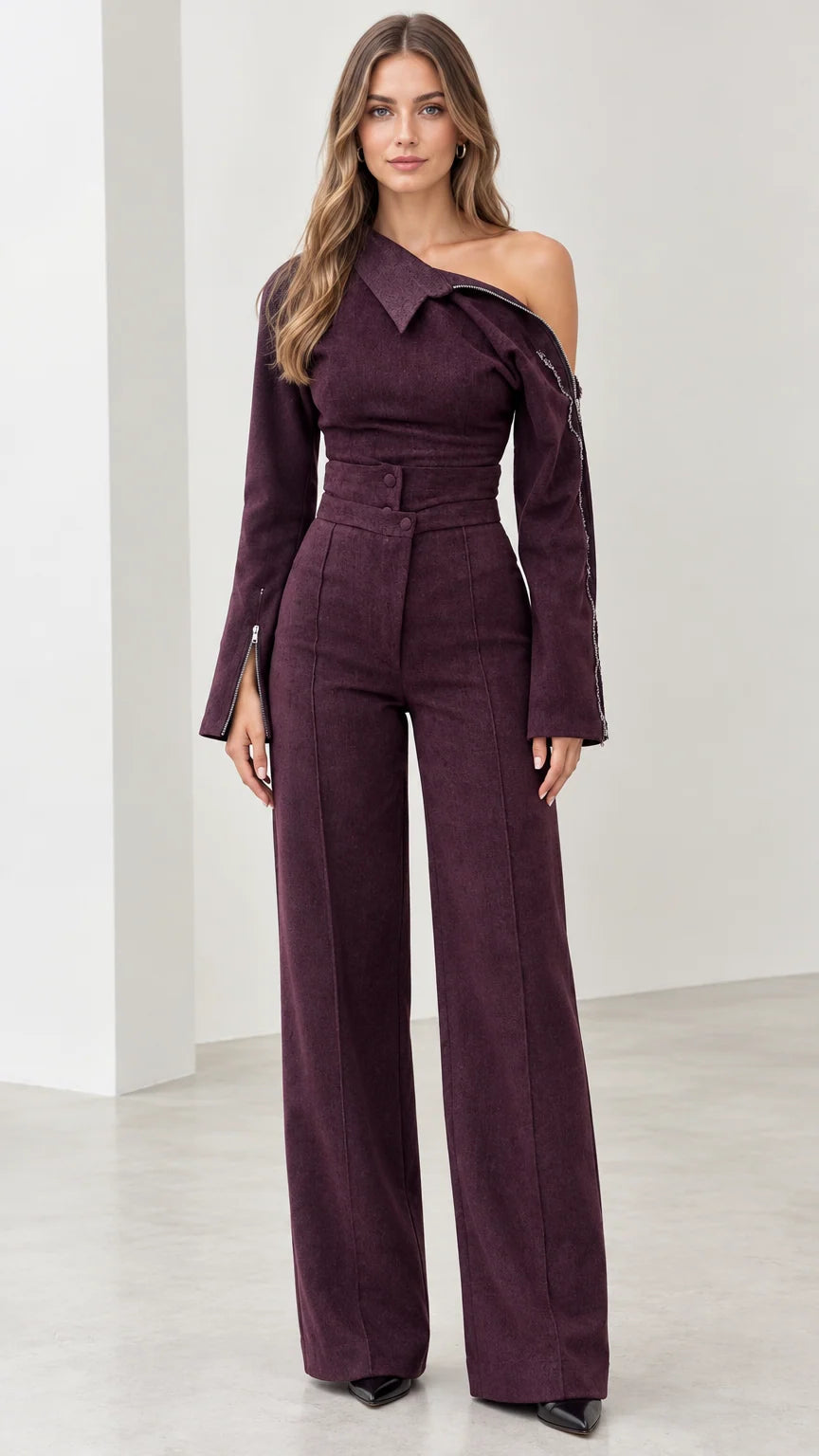 Front view of model wearing plum asymmetric off-the-shoulder wide-leg jumpsuit