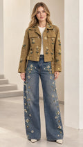 Front full view of camel floral embroidered utility jacket paired with wide-leg jeans