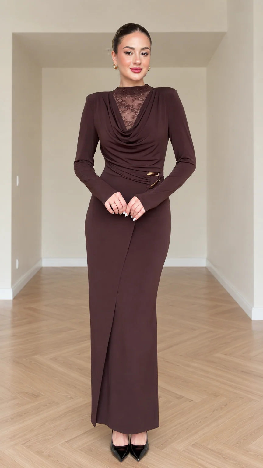 Front view of model wearing chocolate brown draped cowl neck maxi dress with lace insert