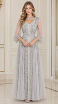 Front full-length view of woman in silver grey embroidered beaded V-neck evening gown