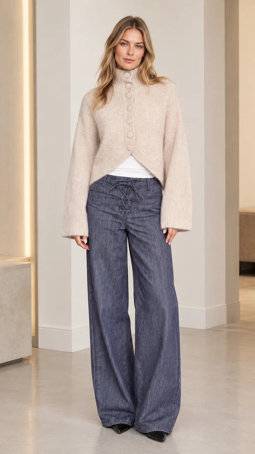 Women's beige high neck fuzzy knit cardigan front view with cutaway hem and wide leg pants