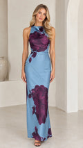 Front view of woman wearing dusty blue floral print halter neck satin maxi dress