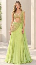 Model wearing lime green embroidered lehenga choli set with matching dupatta - front view