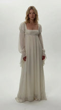Front view of model wearing ivory Regency empire waist chiffon maxi dress