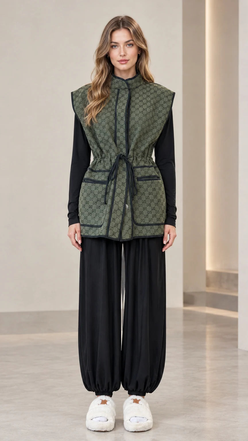 Front full view of woman wearing olive green monogram drawstring waist vest