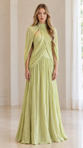 Front full-length view of woman wearing sage green pleated cape-sleeve maxi evening gown