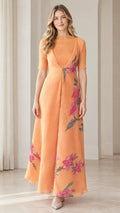 Front view of woman wearing apricot orange floral embroidered maxi dress with half sleeves