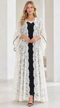 Front full view of white floral lace duster cardigan over black maxi slip dress