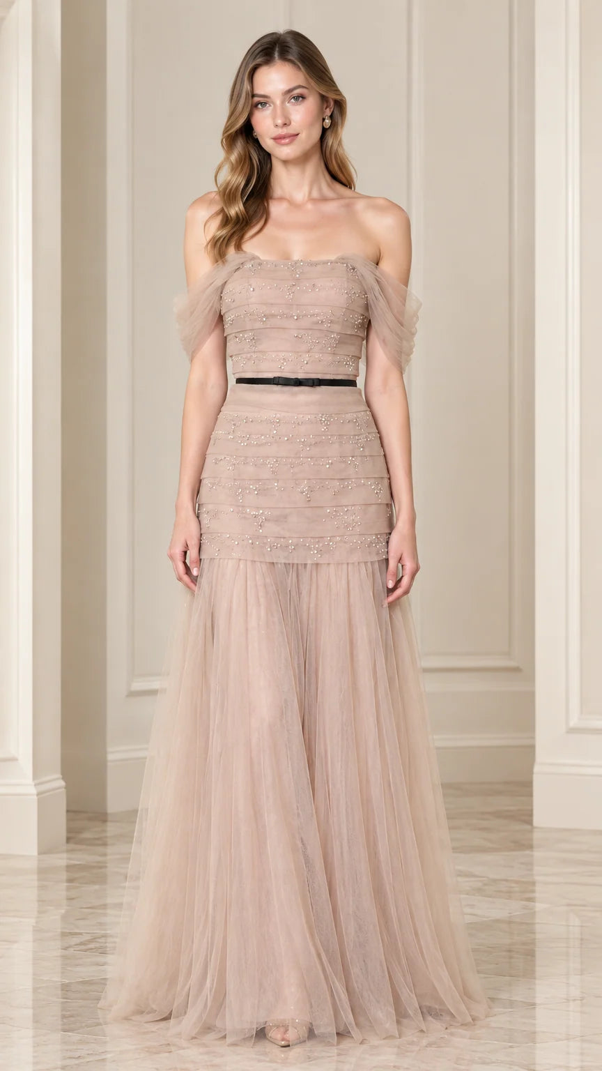 Front full-length view of champagne off-the-shoulder beaded tulle evening gown with black waist ribbon