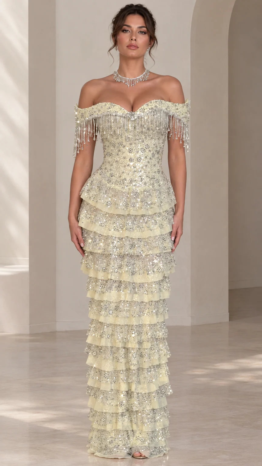 Front view of light yellow off-the-shoulder tiered sequin evening gown with beaded fringe