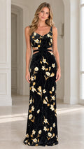Full front view of model wearing black floral velvet maxi dress with waist cut-outs