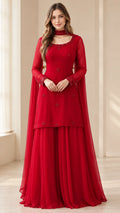 Front full-length view of woman in red embellished sharara suit set