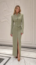 Front view of model wearing sage green stand collar jacket and maxi skirt set