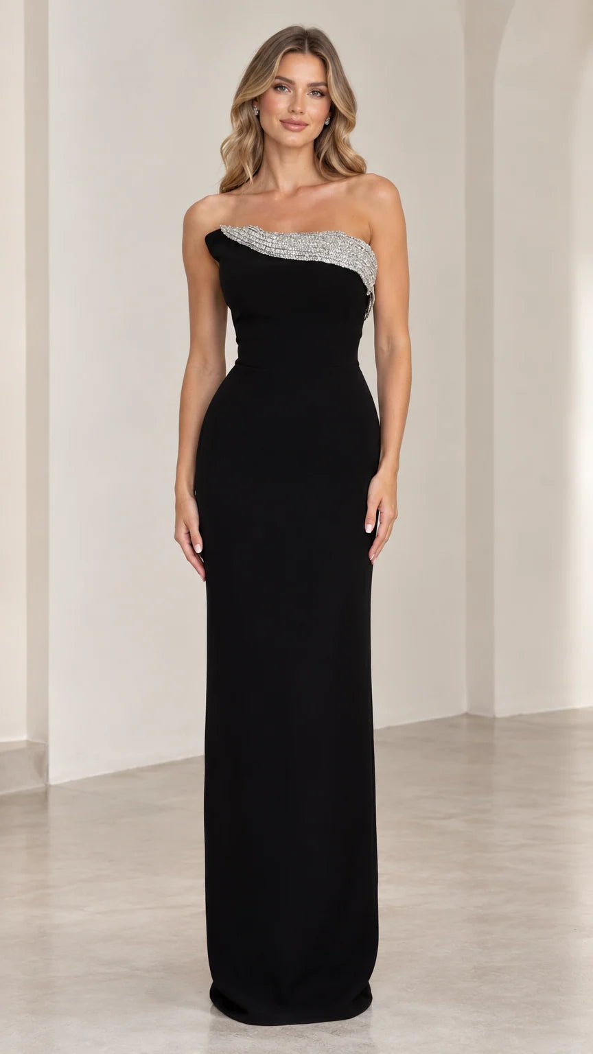 Front view of black strapless column evening gown with rhinestone trim